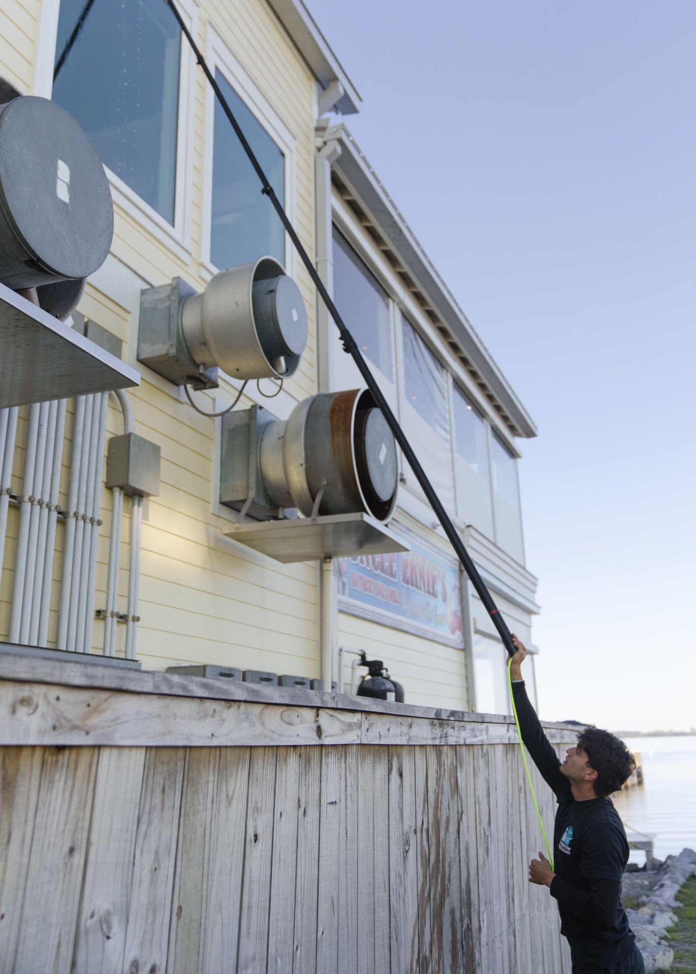 Window cleaning in action with water-fed pole system