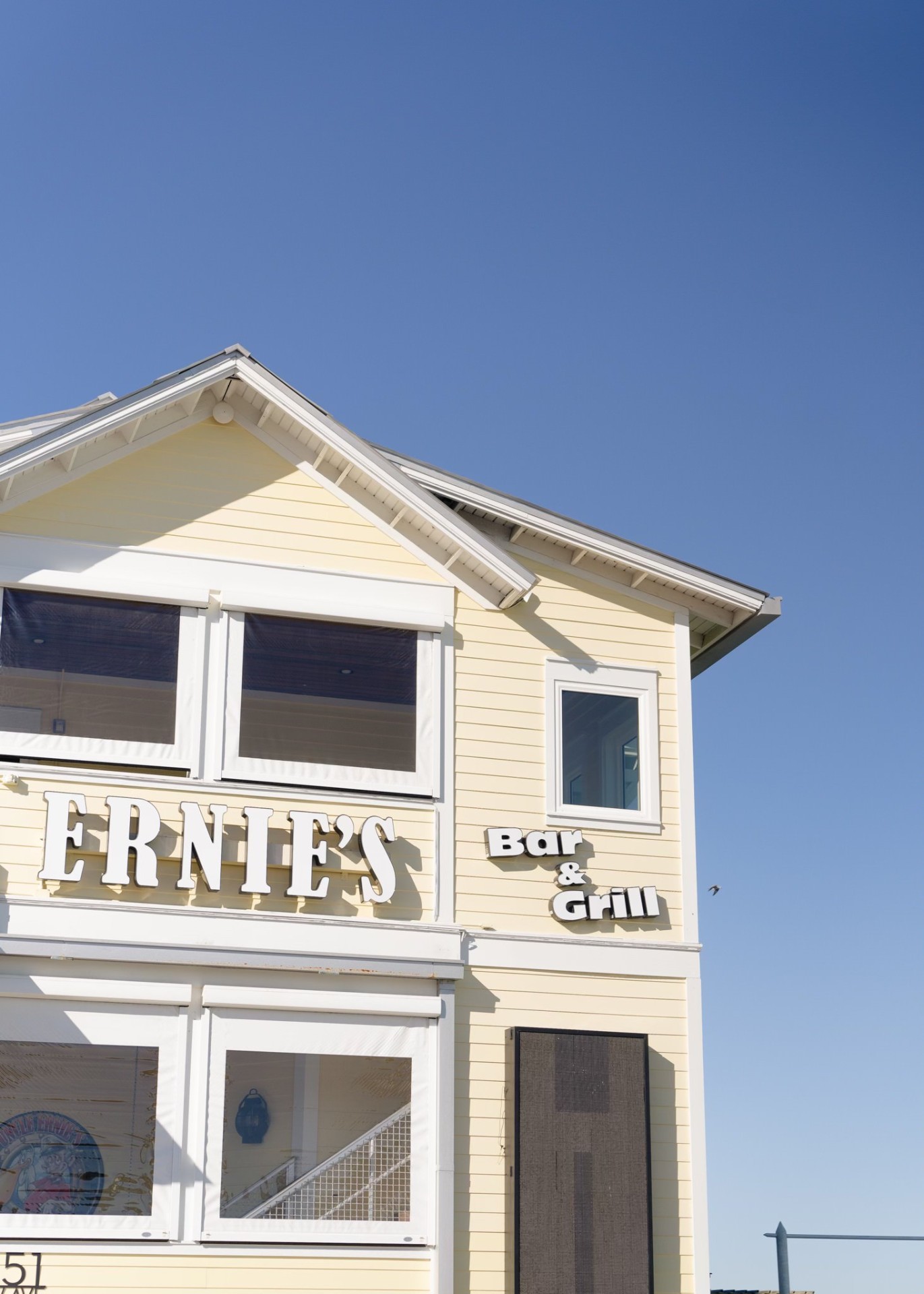 Ernie's Bar & Grill sign with pristine windows